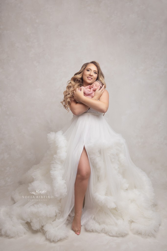 full length portrait of mom and baby during baby girl's newborn photos