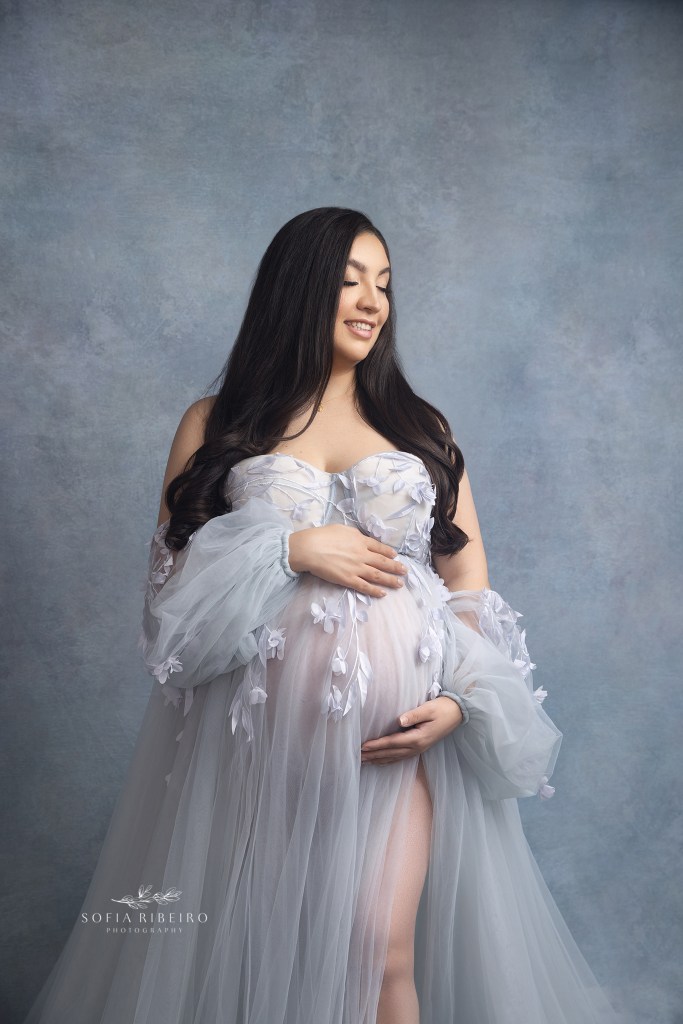a hackensack nj maternity photographer guides moms into graceful poses meant to highlight their changing features