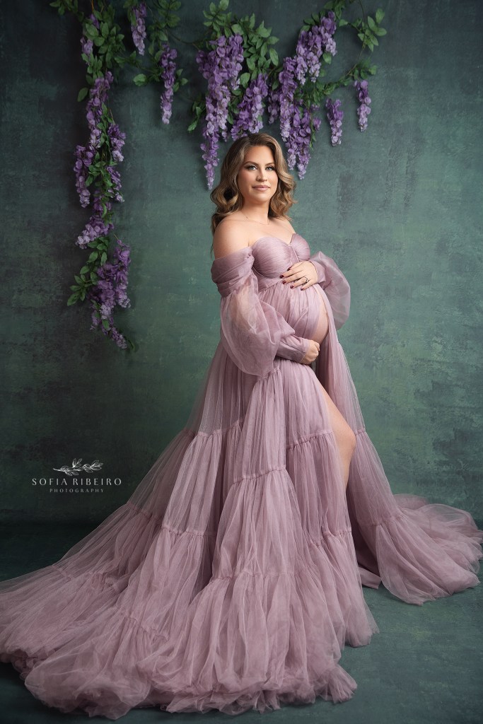 a gorgeous blond mom in a lilac gown against a teal backdrop for a maternity session in hillsborough nj