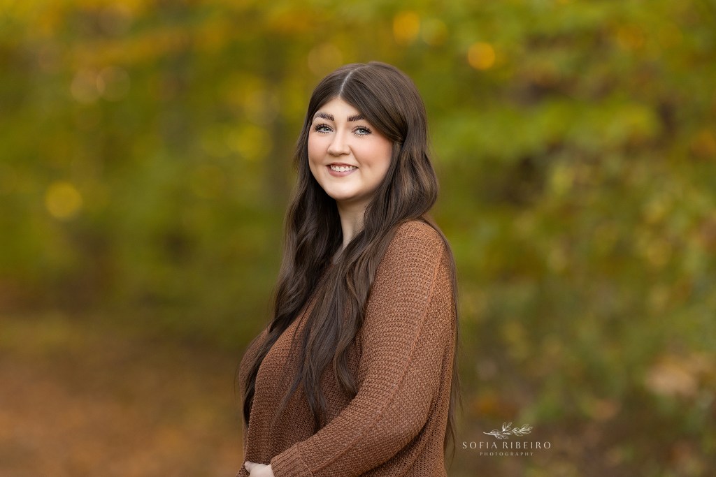 warren nj family photographer captures a portrait of an older sister outdoors in the fall.