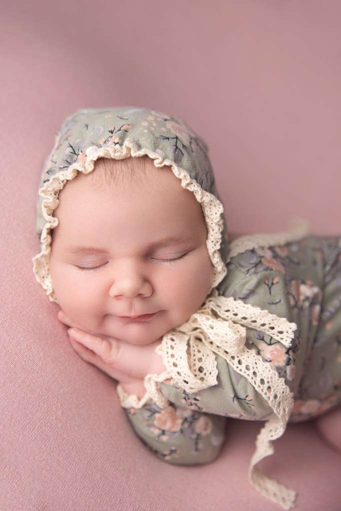 bernards nj newborn photographer photographs a baby girl in a sweet bonnet and outfit combo