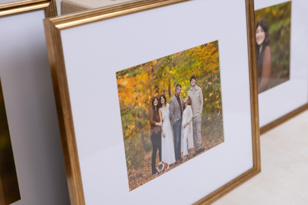 new jersey family photographer captures a gorgeous fall family photo outdoors shown displayed in a gold frame