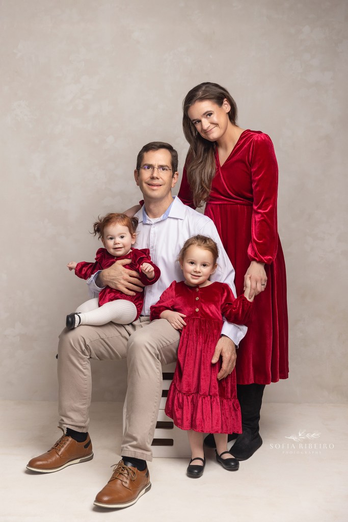 a sweet family portrait in red hues