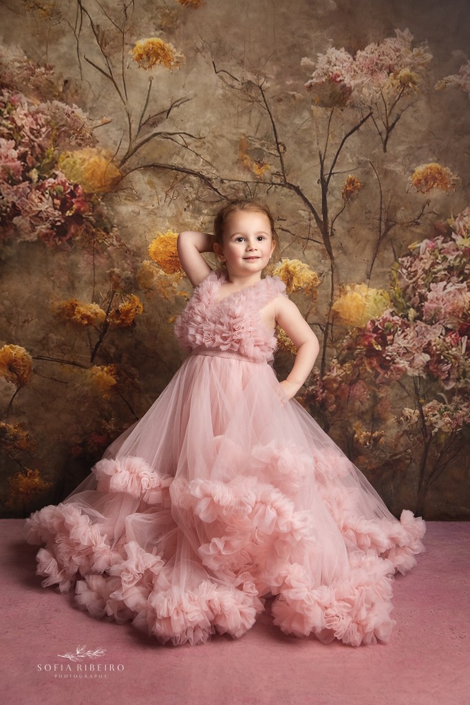 a gorgeous portrait of a 4 year old in a poufy pink princess dress