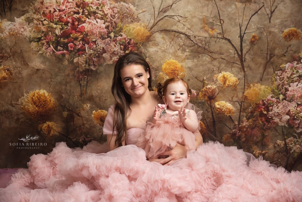 mom poses with daughters for a portrait session with wallington nj family photographer