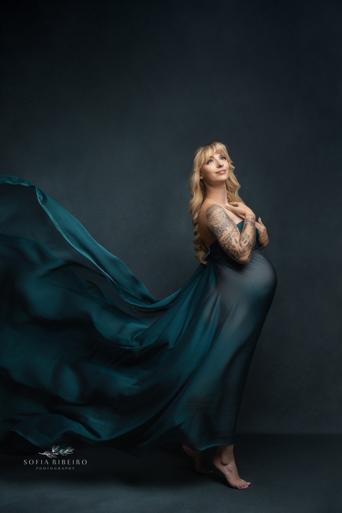 randolph nj maternity photographer drapes mom in a silk fabric highlighting her belly