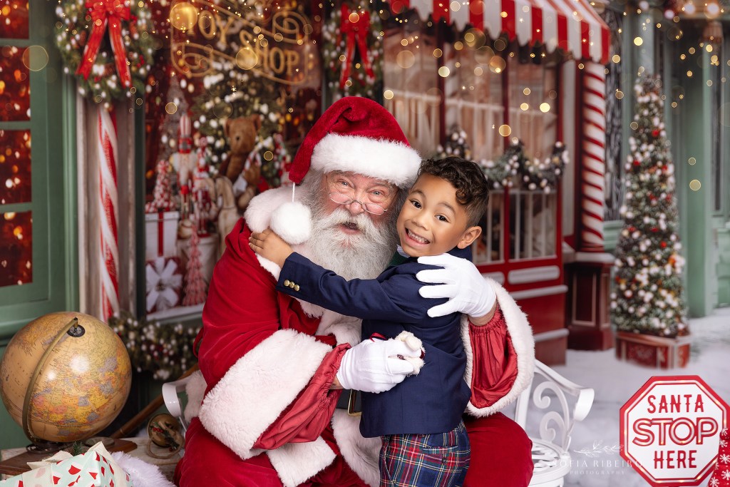 a photographer captures a sweet moment with a child and santa photos in nj