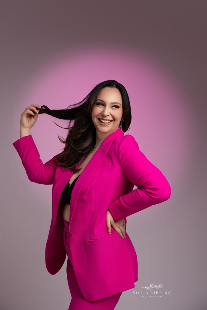 a pink halo highlights this glowing girl in a hot pink suit for her birthday photos in nj