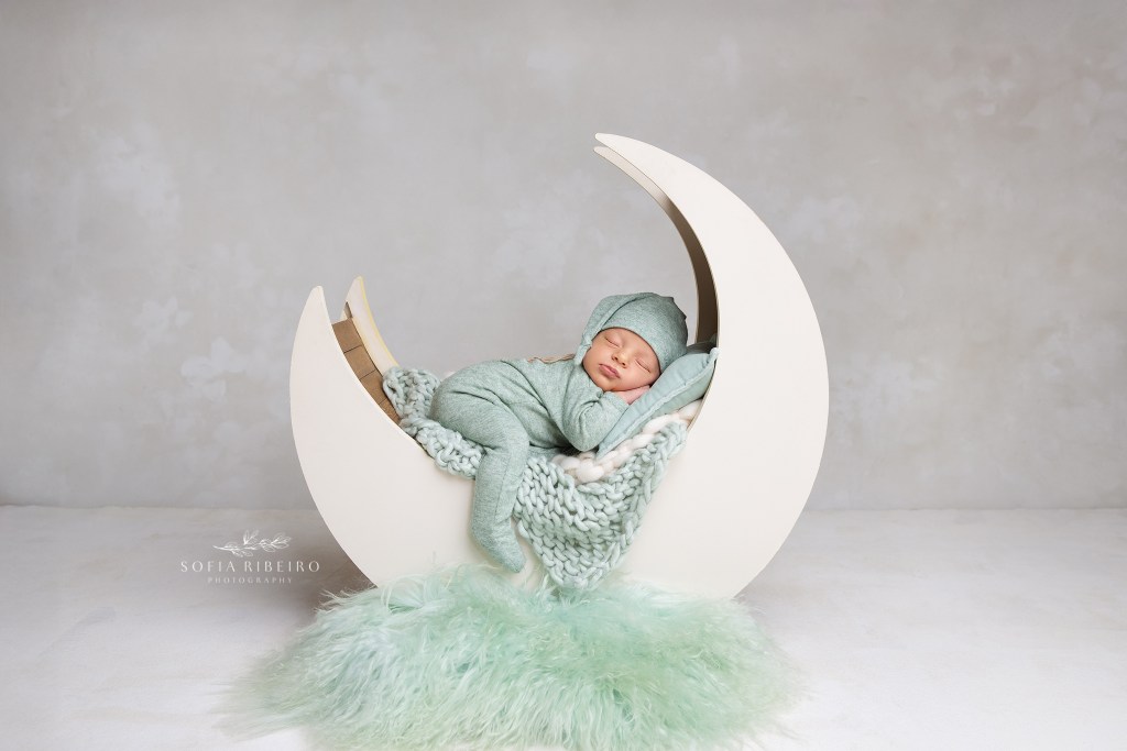 dover nj newborn photographer poses a baby boy on a moon prop