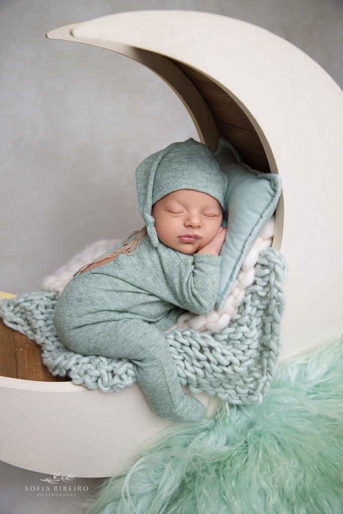 dover nj newborn photographer poses a baby boy on a moon prop