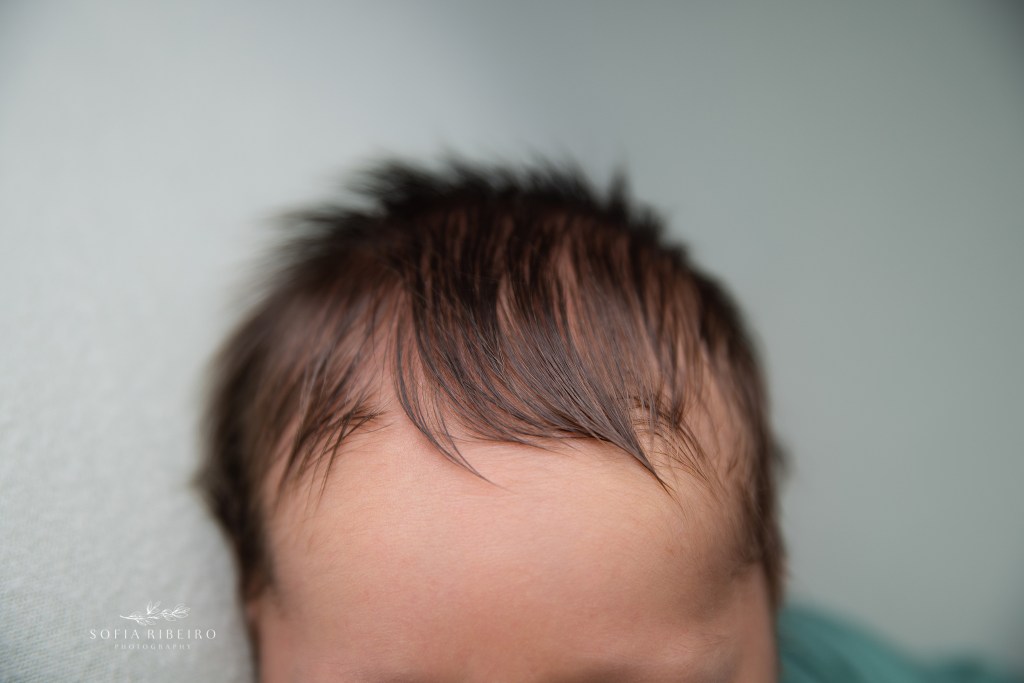 a closeup of newborn baby's hairline