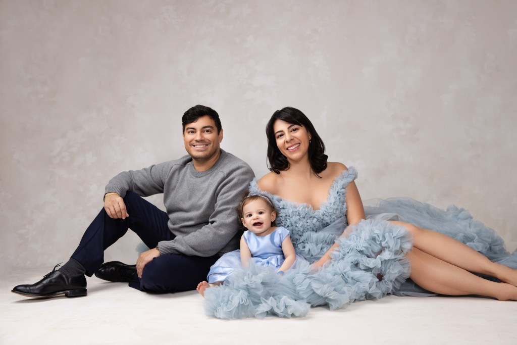 a family poses in shades of blue for a new jersey family photographer