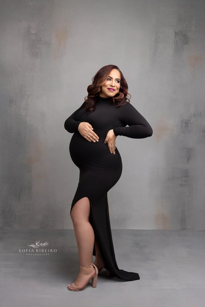 whippany nj maternity photographer poses mom to highlight her growing baby bump for a portrait