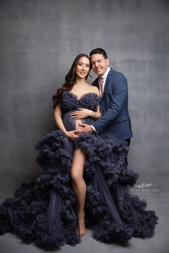 mom and dad pose together for formal maternity portraits with a connecticut maternity photographer