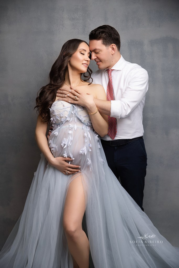 mom and dad pose together for maternity portraits with a connecticut maternity photographer