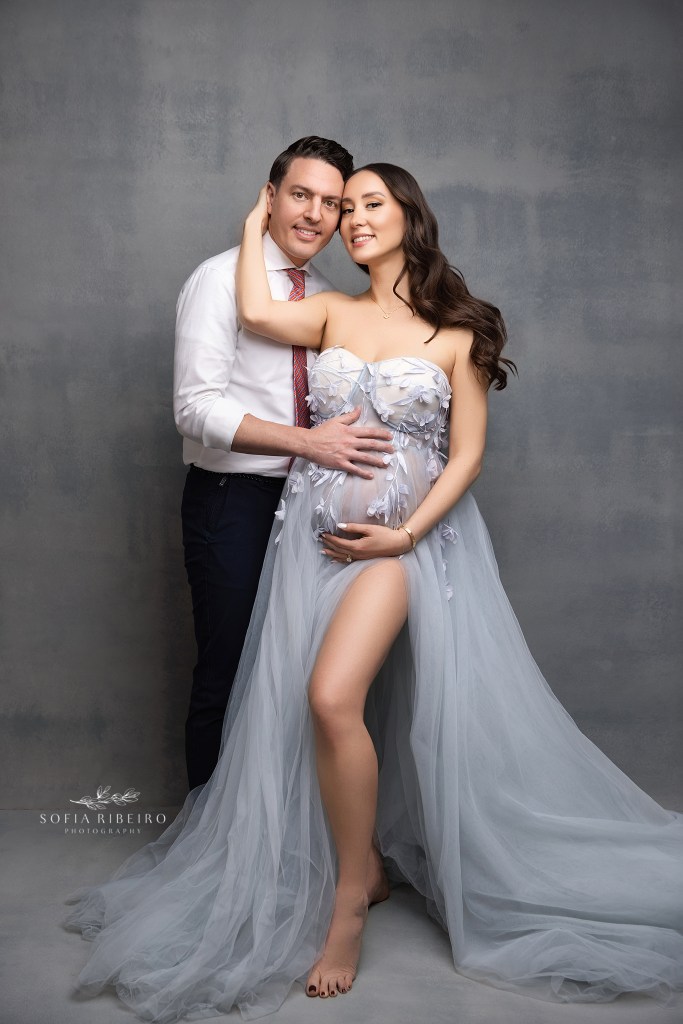 mom and dad pose together for maternity portraits with a connecticut maternity photographer
