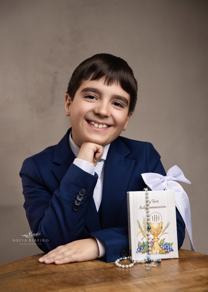 a clark nj communion photographer captures a sweet portrait of a young boy to celebrate his first holy communion