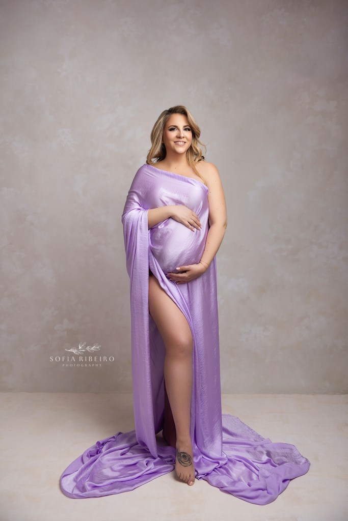 pastel lilac shimmery fabric highlights mom to be's growing bump in this maternity portrait by middletown nj maternity photographer
