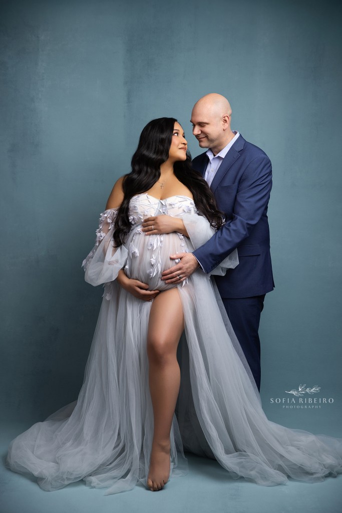 parents to be pose together in an intimate portrait in nutley nj