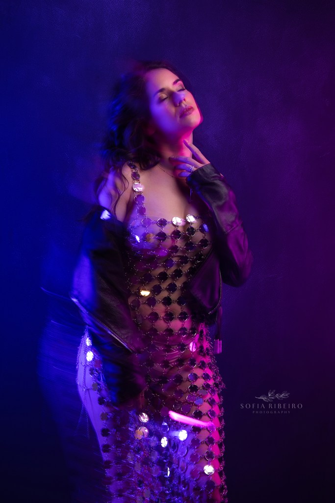 creative colorful gel lighting highlights an edgy outfit for birthday portraits in motion