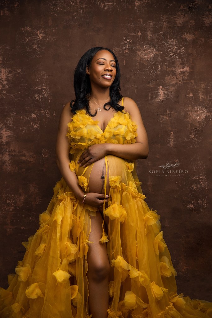 the joy of expecting is seen on this mom to be's face for her maternity portraits in franklin nj