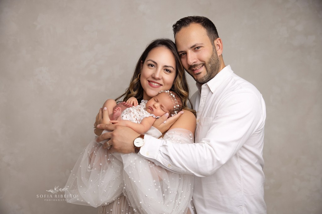 maplewood nj newborn photographer captures beaming parents with their new baby girl