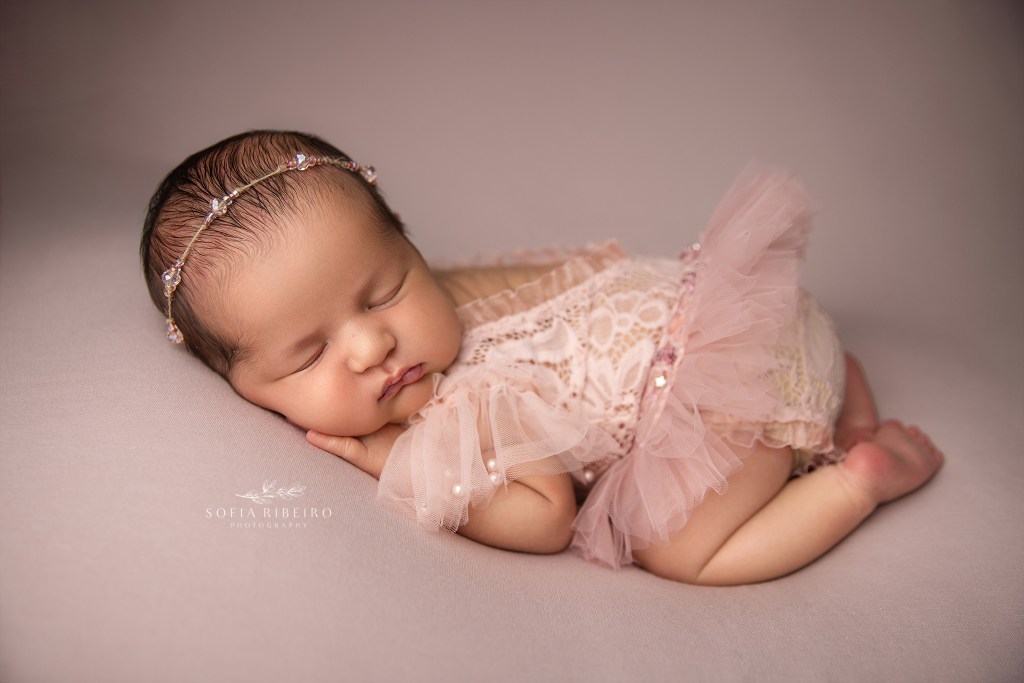 maplewood nj newborn phtoographer captures a chunky baby girl in a pink tulle outfit
