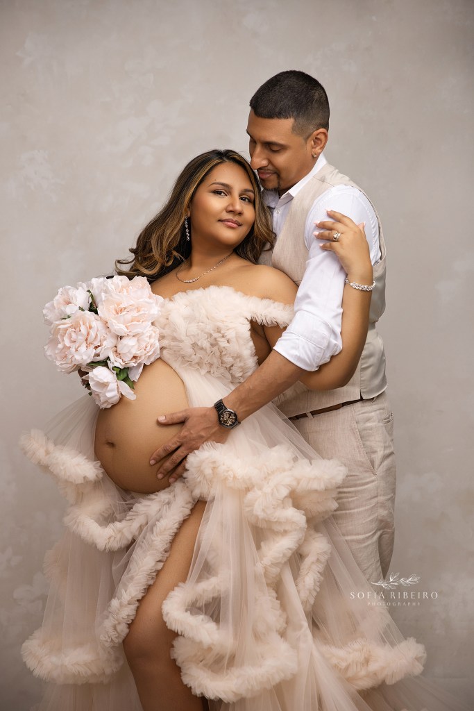 mom and dad share a sweet moment for maternity portraits in north brunswick nj