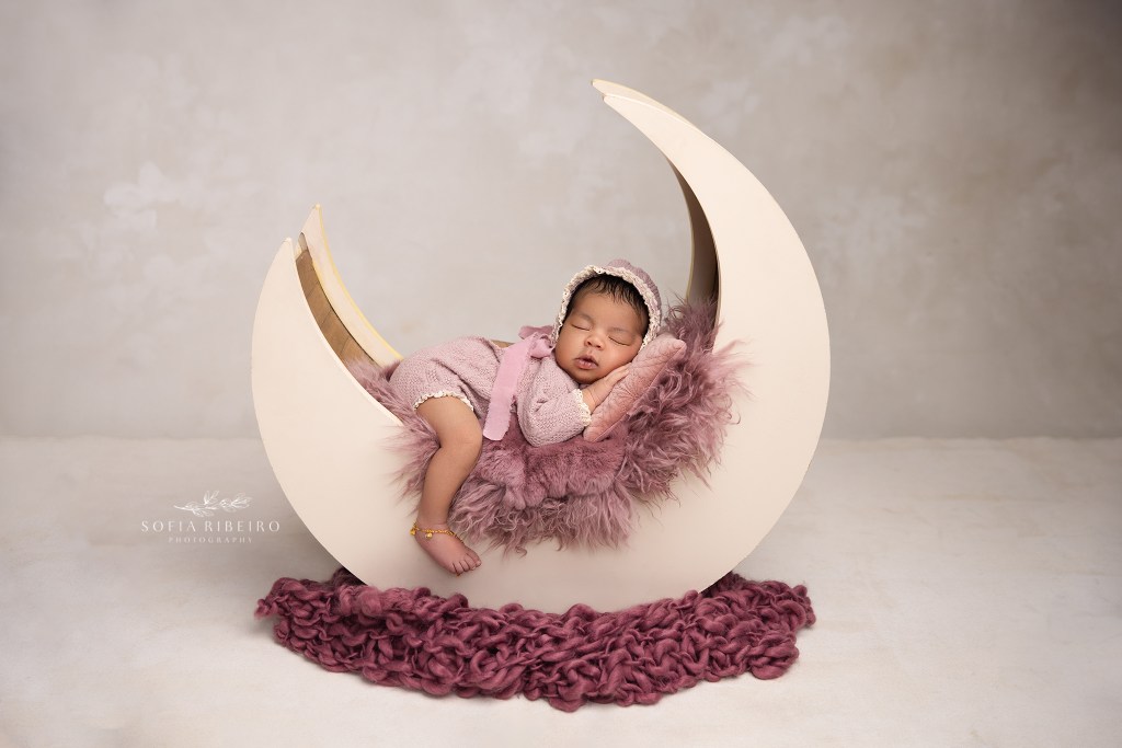 sussex nj newborn photographer poses baby girl on a sleepy moon prop