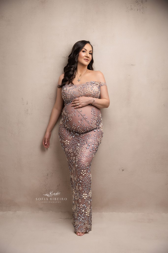 mom to be is a picture of elegance in a rhinestone outfit, styled by a budd lake nj maternity photographer