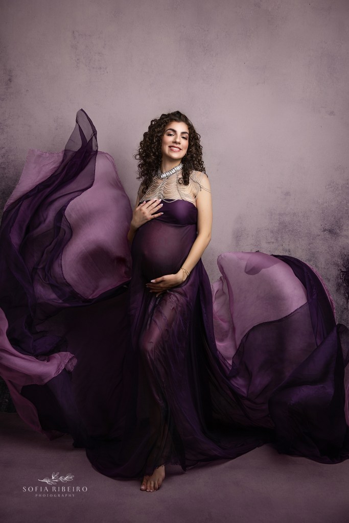 maternity photography studio specializes in capturing moments for expectant moms in the philadelphia nj area. Mom in purple draped fabric over baby bump