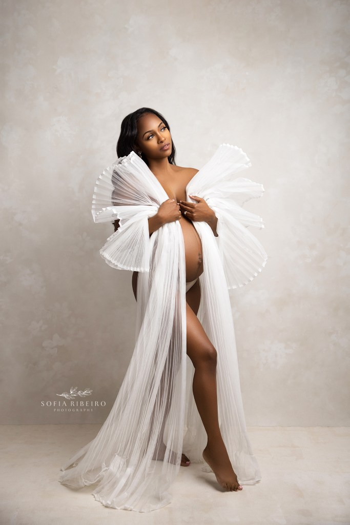 morris plains nj maternity photographer captures a mom in pleated white fabric for maternity photos