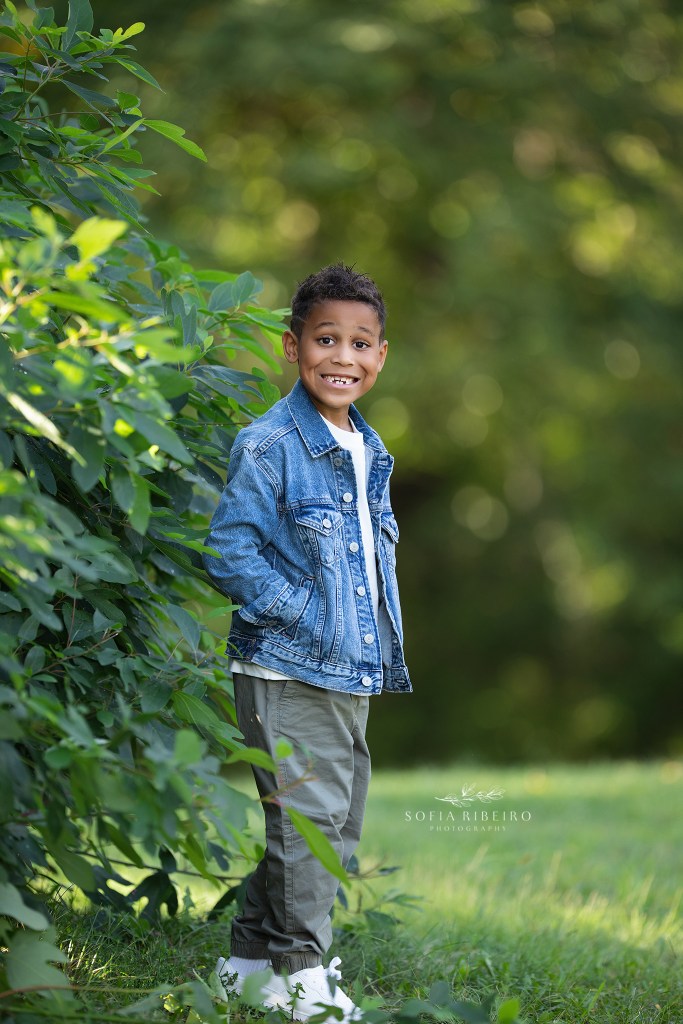 little brother shows all his personality in portraits during a family photo session