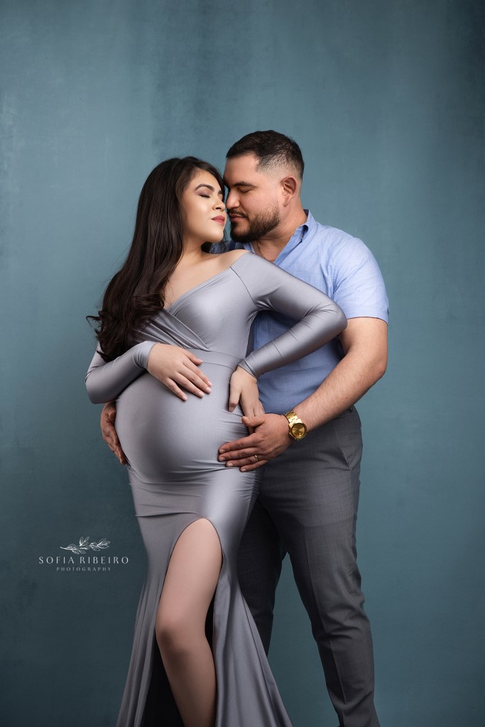an intimate pose for an expecting mom and dad during maternity portraits in edgewater nj