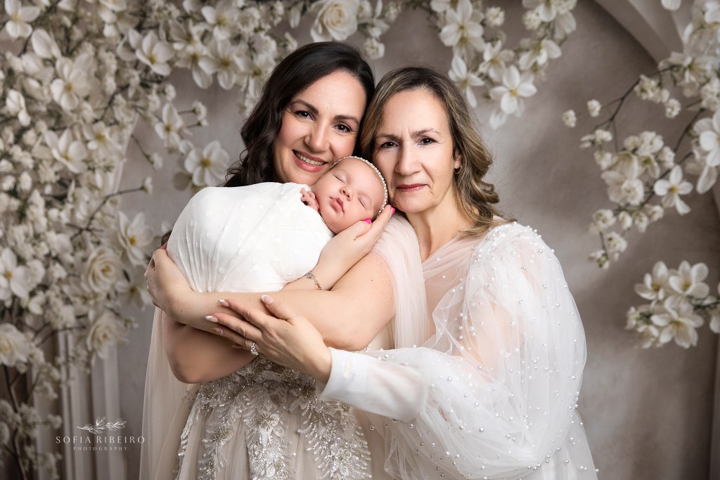 a three generation newborn portrait with baby, mom, and grandma