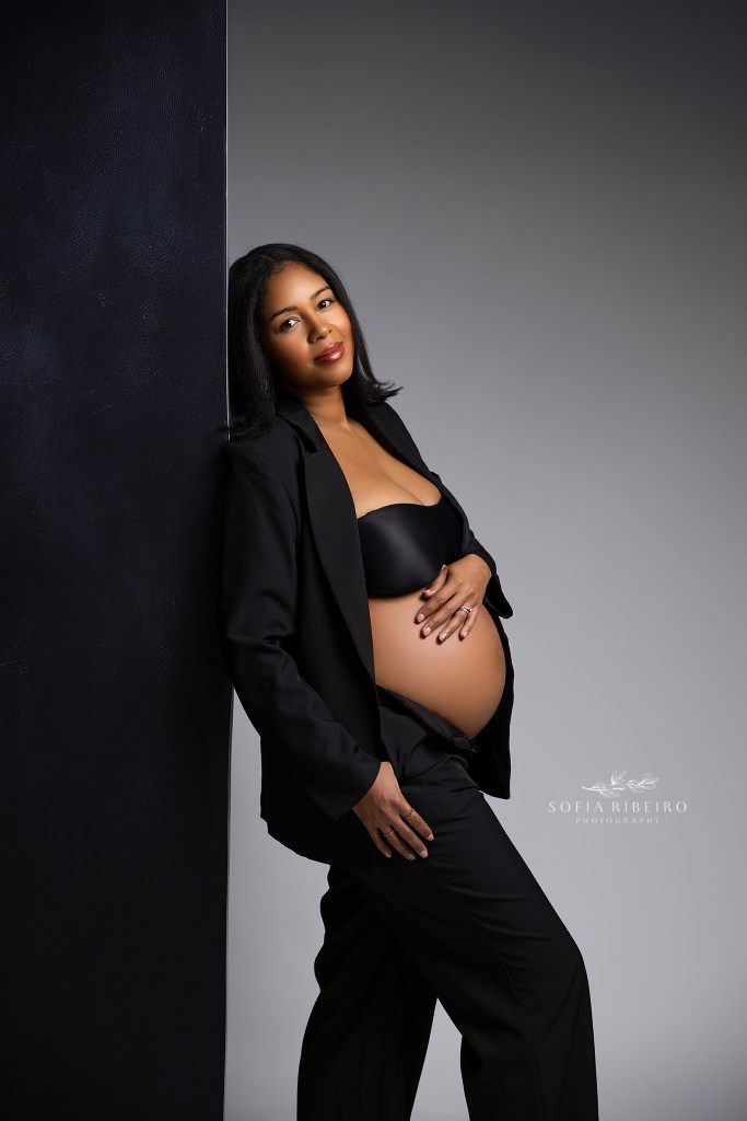 dunellen nj maternity photographer captures a high end fashion portrait of a pregnant mom with baby bump exposed in a black suit.