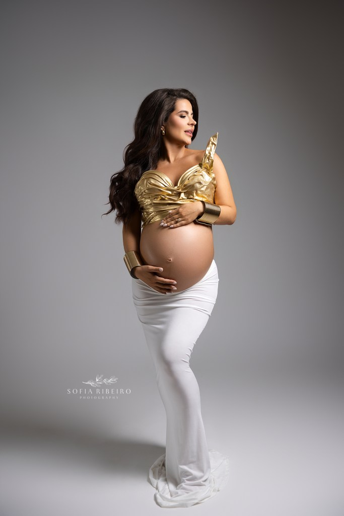a south jersey maternity photographer captures the strength of impending motherhood with a two piece highlighting mom's baby bump in a powerful pose