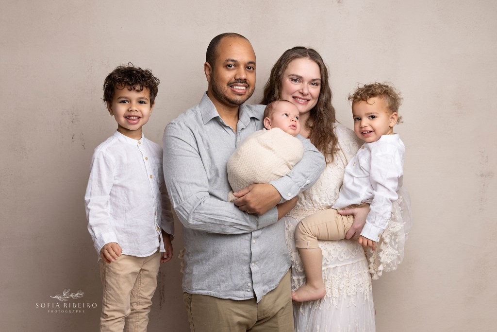 nj newborn photographer captures a family photo with their new baby boy and older brothers