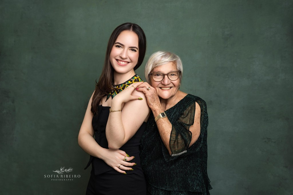 a teenager poses with her great aunt during family photos for a sweet 16