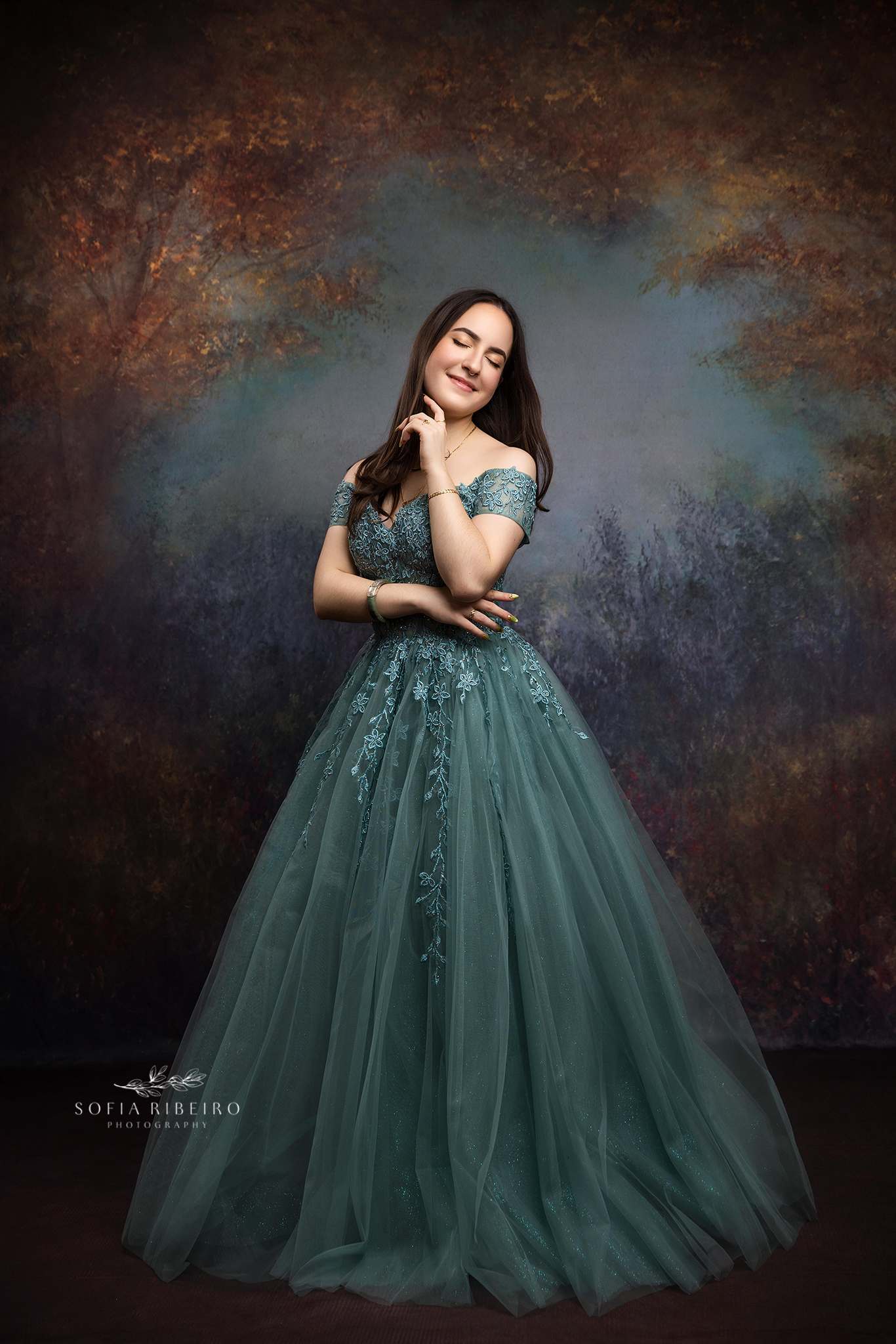 Sweet sixteen session in New Jersey featuring soft sage green tones and an elegant studio backdrop.