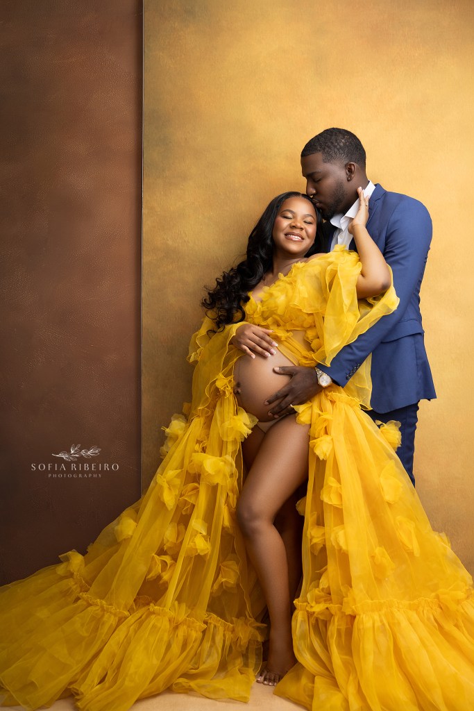 golden tones for this regal maternity session featuring mom and dad in yellow and navy