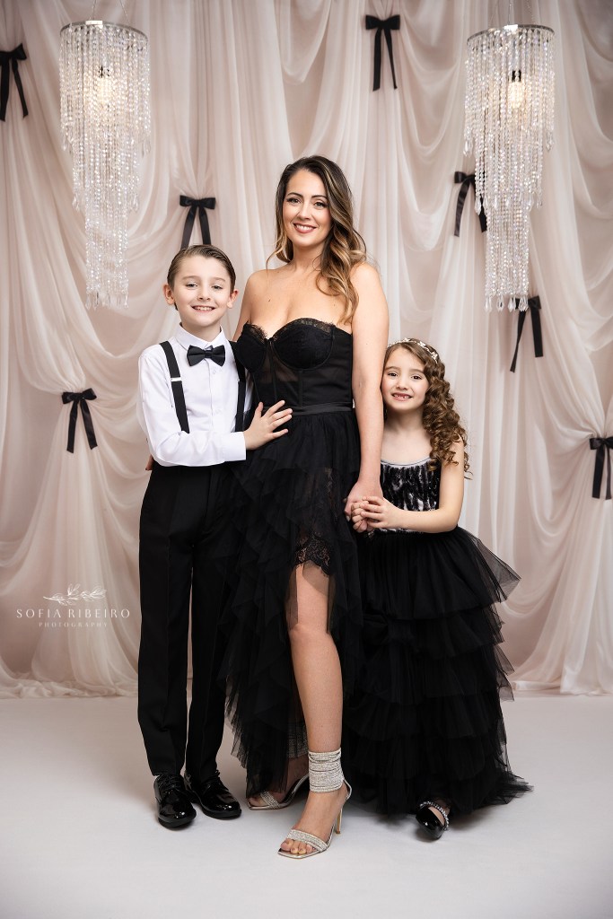 mom poses with her two children for a mom and me portrait in nj