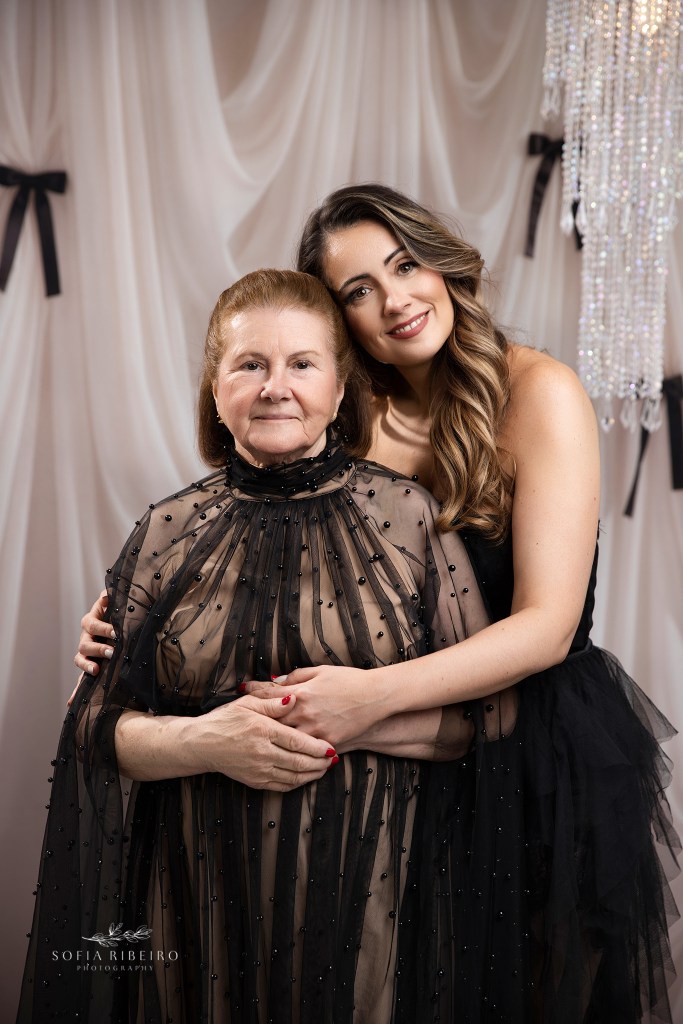 a mother poses with her daughter in an elegant black and white photo set in a portrait photography studio in nj
