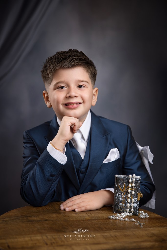 a classic boys portrait for his communion with prayer book and rosary