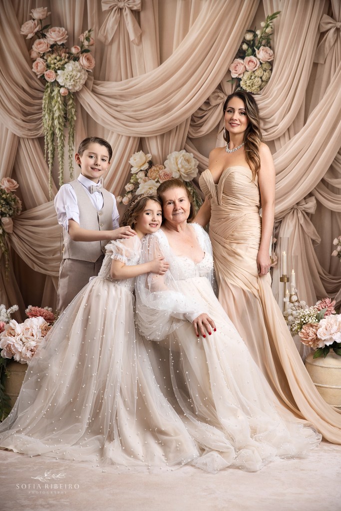 a three generation mom grandmother and children portrait shot against a beige draped backdrop in tones of cream and beige by nj portrait photographer sofia ribeiro photography