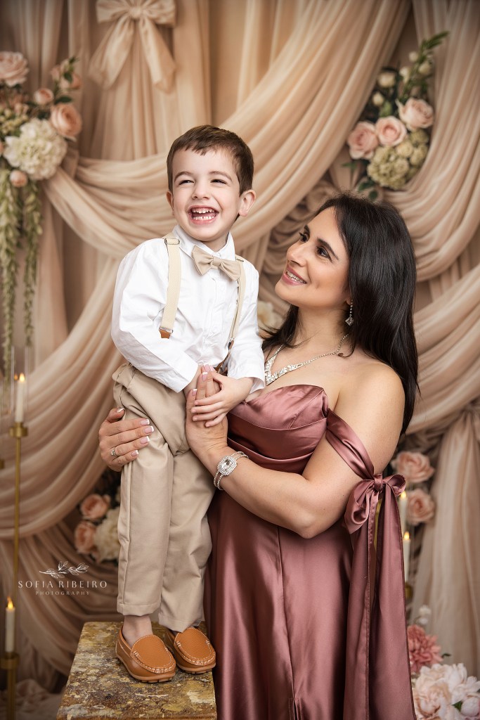 nj family photographer captures mom and her son sharing a giggle during family portraits