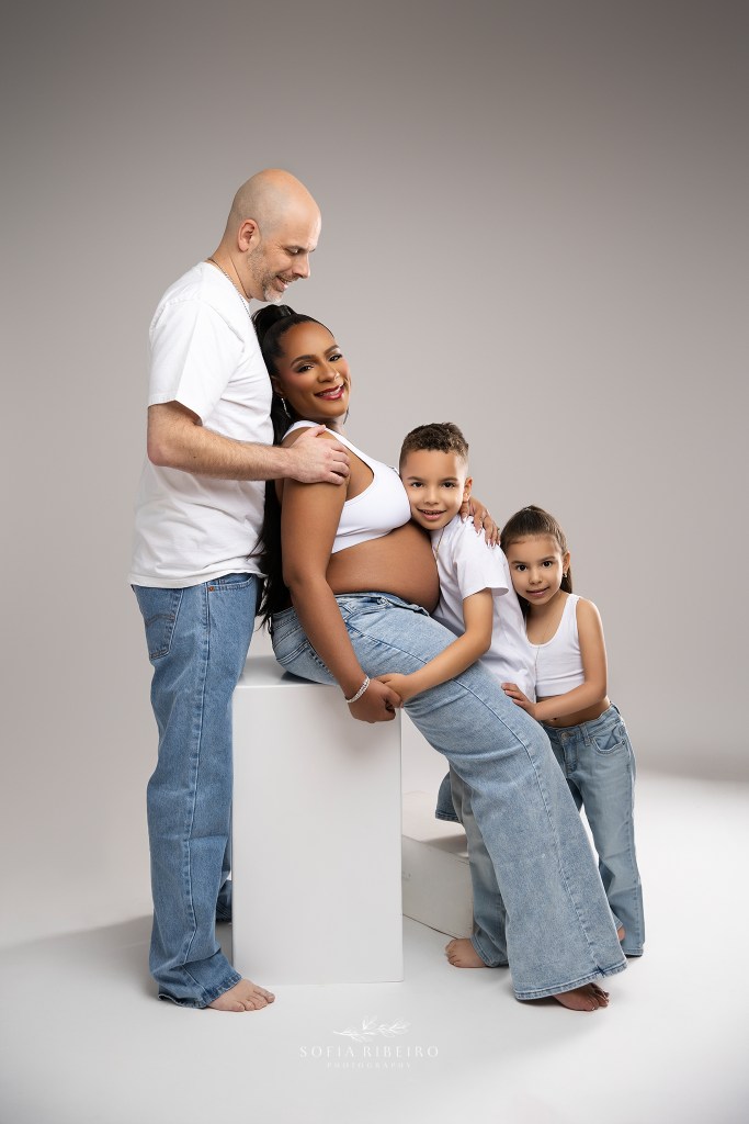 nj maternity photographer captures mom to be with her family in matching denim looks