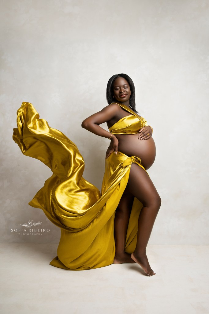 high end maternity photographer in nj captures dynamic fashion portraits in bold yellow tones