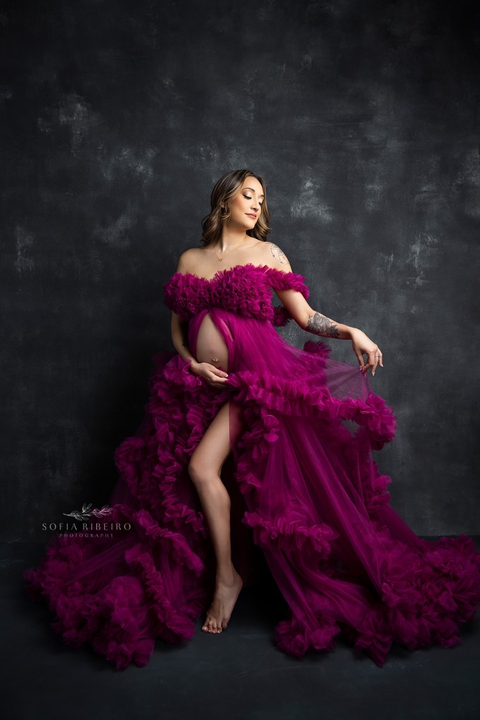 nj maternity photographer specializes in fine art portraits set against a black backdrop with a dramatic gown