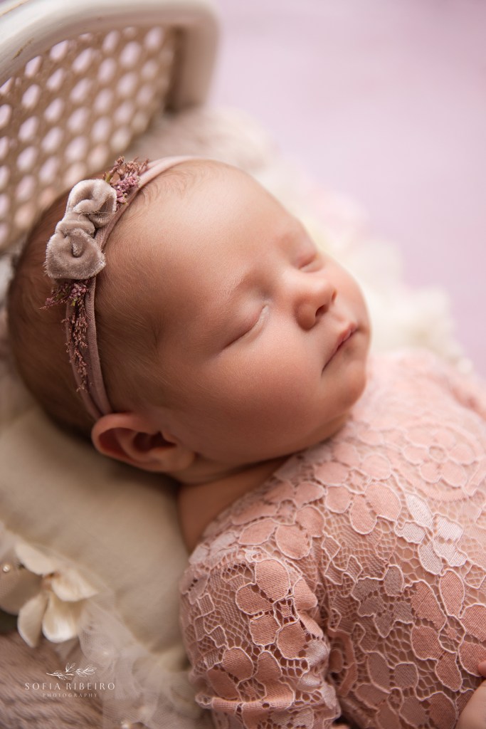 a closeup of baby girl's face during newborn photos